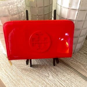 Tory Burch Large Wallet with zip closure in red patent.